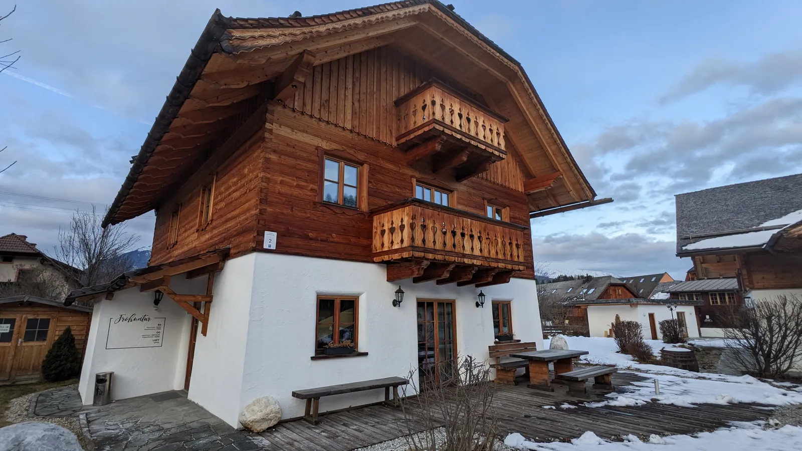 Alpine chalet exterior in winter snow